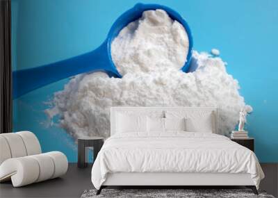 Baking soda on blue background. Wall mural