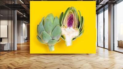 Fresh artichoke on yellow background Wall mural