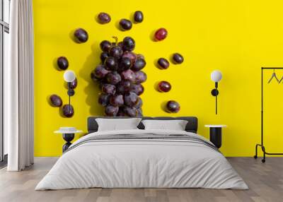 Fresh grape on yellow background. Wall mural