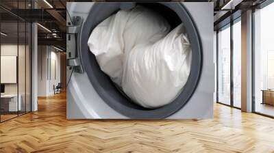 White pillow in washing machine. Wall mural