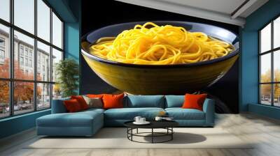 Delicious yellow noodle soup on black background Wall mural