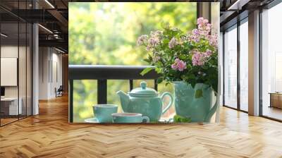 Serene balcony with a small table set for tea. Herbal tea cups and a teapot are ready to enjoy Wall mural