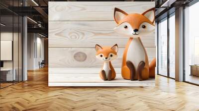 Two cute wooden fox figurines side by side on a light wooden background Perfect for decorating a kid s room or as a playful deco Wall mural