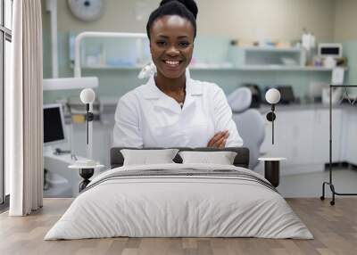 Beautiful and confident African female dentist with a friendly smile standing inside a blurry modern clinic Wall mural