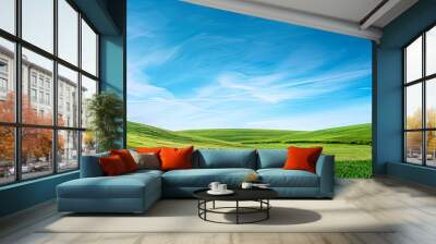 Idyllic summer scene with a lush green meadow rolling hills in the distance and a brilliant blue sky Wall mural