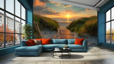 Wooden path leading to the sea with sunset, grassy sand dunes, summer time, golden hour light Wall mural