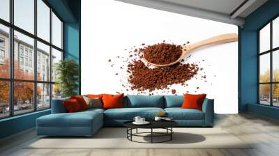 Roasted ground coffee in wooden spoon on white background. Wall mural