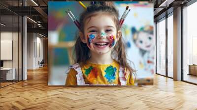 Cheerful young girl Paint bright colors on drawing paper. and a paint brush sticking out of his hair, smiling broadly, an easel with her imaginative paintings standing behind him. Wall mural