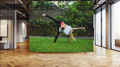 Modern style dancer jumping on nature background Wall mural