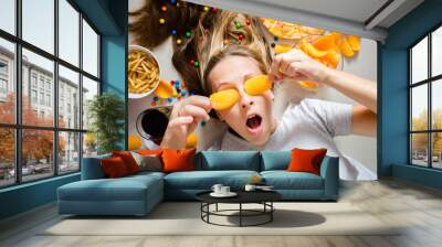 Unhealthy concept. Woman with unhealthy food: pizza, lemonade, c Wall mural