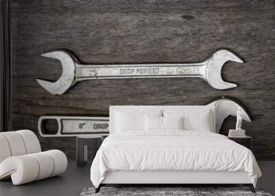 old wrench steel tools on aging wood background Wall mural