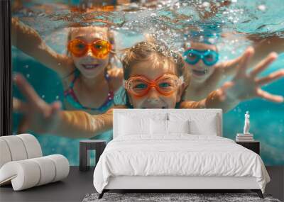 children playing under the pool with goggles summer concept Wall mural