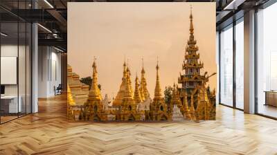 Group of stupa in area of Shwedagon pagoda is Yangon's most famous landmark in Myanmar at sunset. Shwedagon Pagoda enshrines strands of Buddha's hair and other holy relics. Wall mural