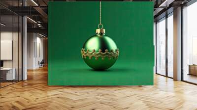 This is a beautiful image of a green Christmas ornament. It is hanging from a gold chain and has a gold decorative band around the middle. Wall mural