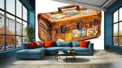 Vintage travel suitcase with worn leather and stickers. Wall mural