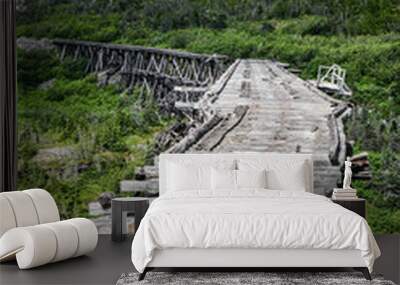 broken wooden bridge in the mountains Wall mural