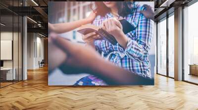 Group of Christians are congregants join hands to pray and seek the blessings of God, the Holy Bible. The cross symbol. They were reading the Bible and sharing the gospel with copy space. Wall mural