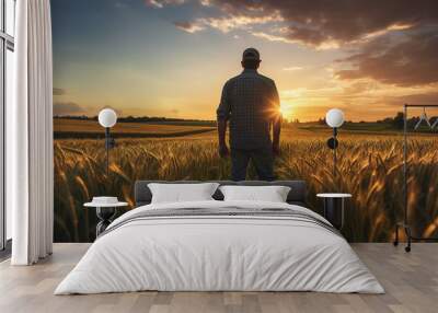 Farmer looking over his farm field Wall mural