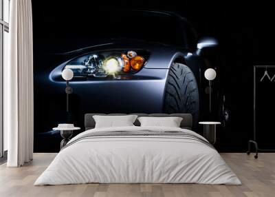 Sports car in dark setting Wall mural