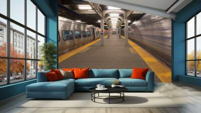 Long Exposure of high speed train passing station platform waiting departing train at railroad terminal hub Wall mural