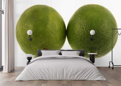 Two green limes isolated on a white background Wall mural