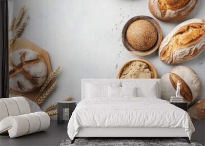 Freshly baked artisanal bread on a rustic table with grains Wall mural