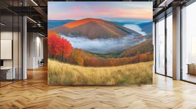 Misty autumn mountains at dawn with vibrant fall foliage Wall mural