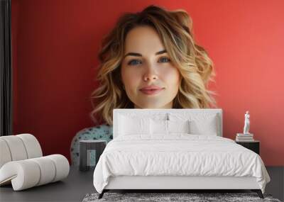 Portrait of a Woman With Curly Hair Against a Red Background Wall mural