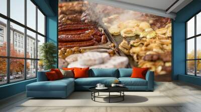 Assorted delicious grilled meat, sausage, potatos with vegetables and cheese on a barbecue Wall mural