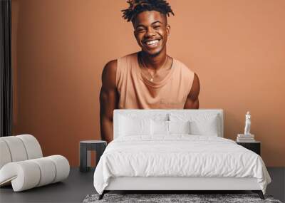 Young black man with stylish afro hair smiling in studio. Generative AI. Wall mural