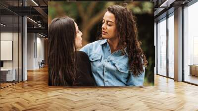 Couple of women looking Wall mural