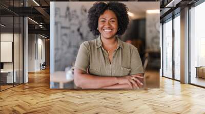 poportrait of a coffee shop owner in Latin America with her arms crossed smiling at the camera Wall mural