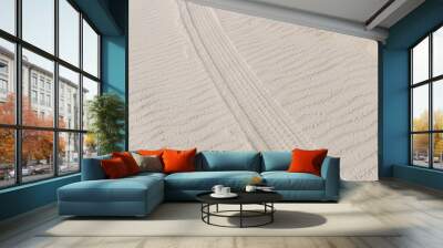 Tire trail in the sand of dunes on the beach or desert. Wall mural