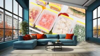 Frozen food in the refrigerator. Vegetables on the freezer shelves. Wall mural