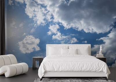 sky blue light of the sun through the clouds in the sky Wall mural