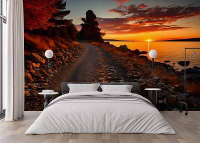 Sunset or sunrise orange landscape view of the coast Wall mural