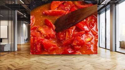 tomato frying on pan, cooking vegetable sauce, herbs. Wall mural