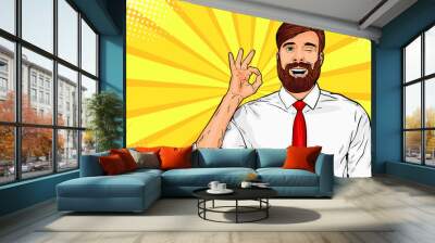 Hipster beard male businessman winks and shows okay or OK gesture. Pop art retro vector illustration. Success concept. Invitation poster. Wall mural