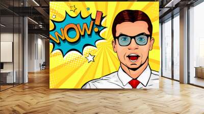 Wow pop art male face. Young surprised man in glasses with open mouth and Wow speech bubble. Vector colorful illustration in retro comic style. Wall mural