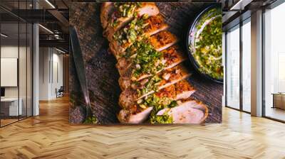 Homemade grilled pork steak with chimichurri verde sauce on cutting board on dark background Wall mural