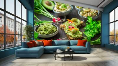 Wholemeal bread with avocado spread and vegetables Wall mural