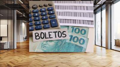 Bills to pay (Boleto system with Bar codes), calculator and Brazilian money.  Brazilian payment concept.  Wall mural