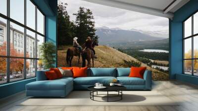 horseback riding in the mountains Wall mural