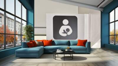 Nursing Room sign made of metal, above a doorway in an office environment. Special room for mothers of infant children to tend to their needs. Wall mural