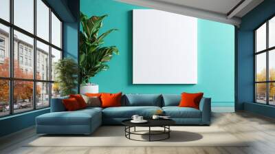 blank vertical canvas handing on mint wall in home living room Wall mural