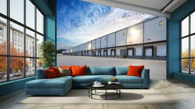 Exterior of modern distribution center warehouse at sunrise Wall mural