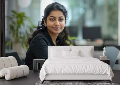 Indian Woman business executive working on laptop computer in a modern office Wall mural