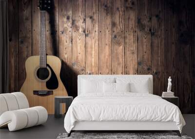 Acoustic guitar against blank wooden plank panel grunge background with copy space Wall mural