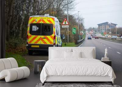 Mobile radar speed safety camera unit parked at the side of a city road Wall mural