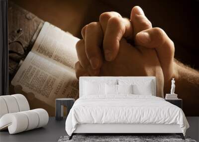 Praying hands on an open bible Wall mural